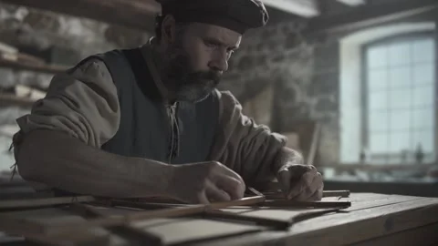 Inventor tying a knot with a linen thread on an ornithopter wing frame Vídeo Stock 339232451