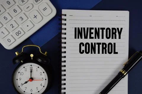 Inventory Control text written on notepad with calculator and alarm clock o.. Stock Photos