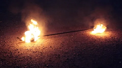 Inventory for the fire show. Burning Spark staff with kerosene. Slow motion. Stock Footage 236078191