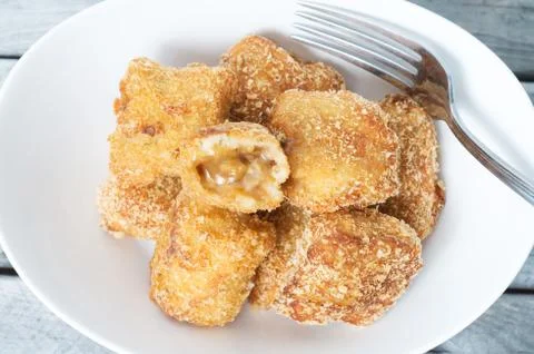 Inversed poutine - inside out poutine - cheese and brown sauce inside covered Stock-Fotos