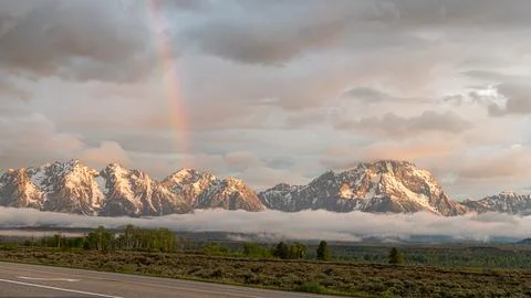 Inversion Clouds and Rainbow at dawn in Grand Teton Nat Park, Wyoming Stock Photos