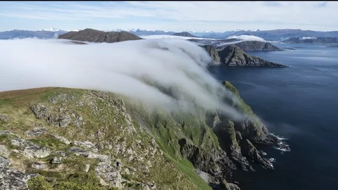 Inversion flowing over the cliff Stock Footage 122949484