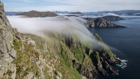 Inversion flowing over the cliff Stock Footage 122951943