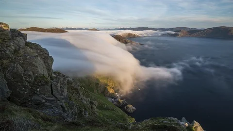 Inversion flowing over the cliff Stock Footage 122955190