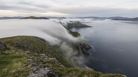 Inversion flowing over the cliff Stock Footage 122965335