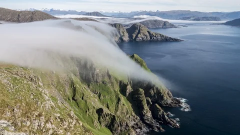 Inversion flowing over the coastline Stock Footage 122950478