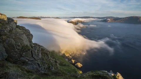 Inversion flowing over the coastline Stock Footage 122954787