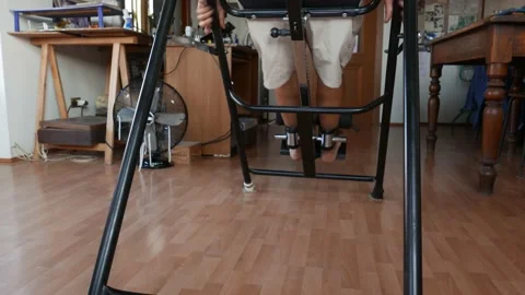 Inversion table gym man Stock Footage 135374467