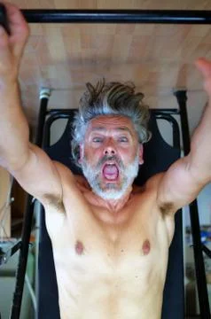 Inversion table gym man Stock Photos