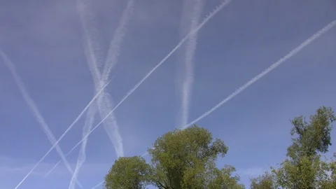 Inversion traces from aircraft on a blue clear and clear sky Stock Footage 85627242