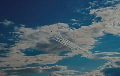Inversion trail of the plane. A small plane practices aerobatics Stock Photos