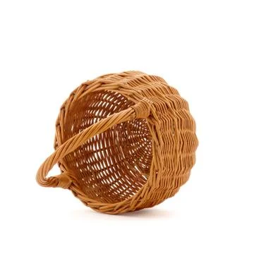 Inverted empty wicker basket on a white background Stock Photos