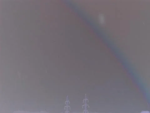 Inverted image - Abstract image of beautiful rainbow on a sparse cloud after Stock Photos