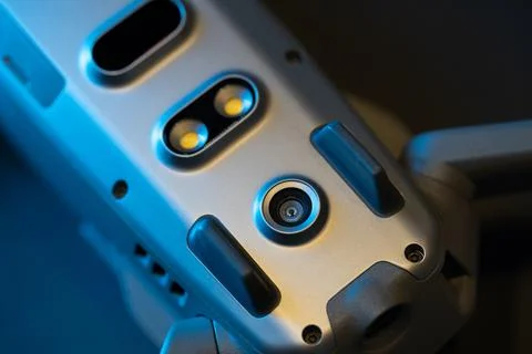 An inverted Mavic 2 Pro quadcopter on a black background in blue light. Infrared Stock Photos