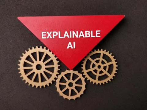 A inverted red triangle labeled EXPLAINABLE AI rests above three interlocki.. Stock Photos