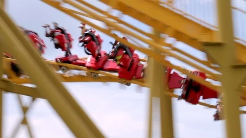 Inverted Roller Coaster Moving Through Twists and Turns Stock Footage 95911238