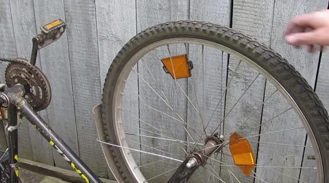 Inverted spinning bicycle wheel Stock Footage 57324183