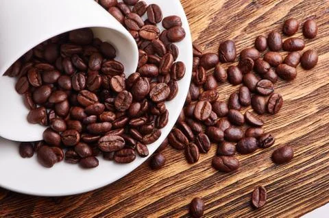 Inverted white cup with coffee Stock Photos