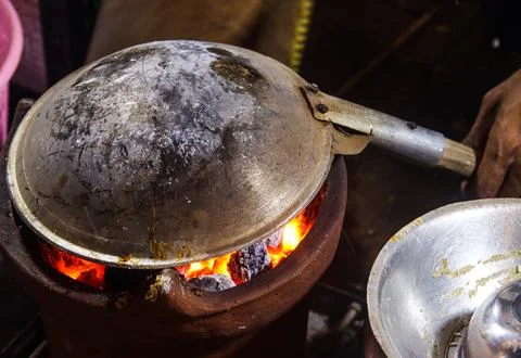 Inverted Wok Cooking Process for Kerak Telor Direct Over Glowing Charcoal E.. Stock Photos