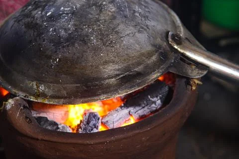 Inverted Wok Cooking Process for Kerak Telor Direct Over Hot Charcoal Ember.. Stock Photos