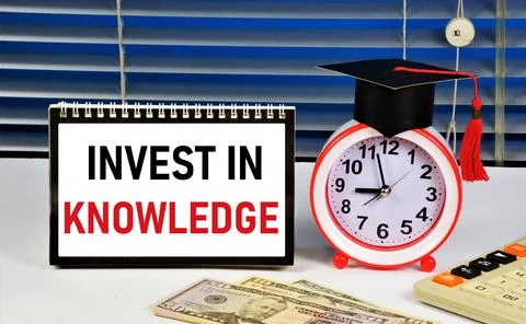 Invest in knowledge. The text label in the planning plate. Stock Photos