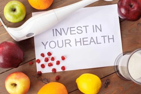 Invest in your health paper surrounded with fruits healthy lifestyle top view Stock Photos