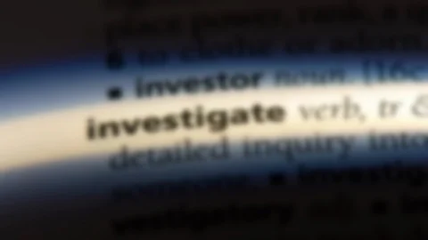 Investigate word in a dictionary. Stock Footage 99561554