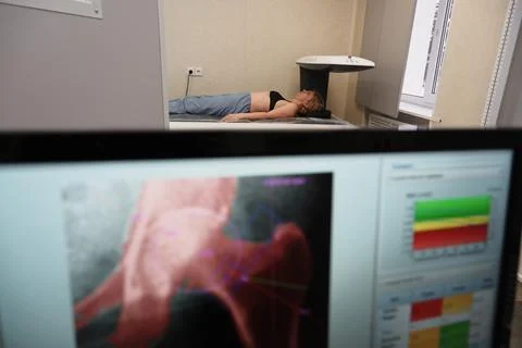 Investigation of the density of human bones using an osteodensitometry appara Stock Photos