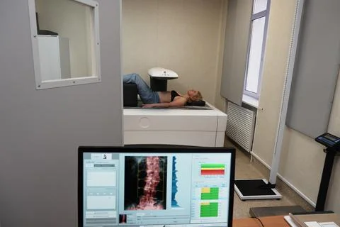 Investigation of the density of human bones using an osteodensitometry appara Stock Photos
