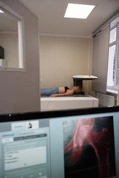 Investigation of the density of human bones using an osteodensitometry appara Stock Photos