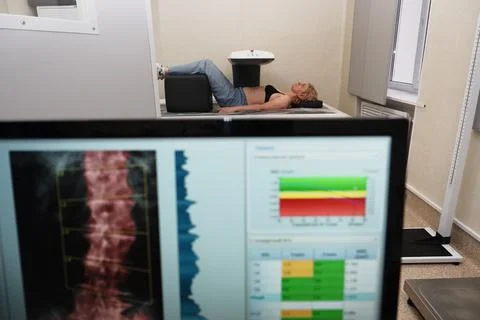Investigation of the density of human bones using an osteodensitometry appara Stock Photos