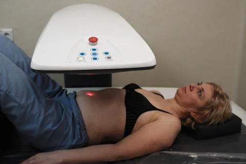 Investigation of the density of human bones using an osteodensitometry apparatus Stock Photos