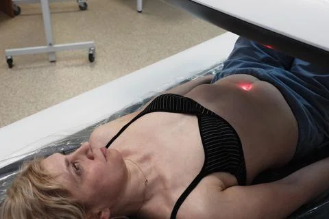 Investigation of the density of human bones using an osteodensitometry apparatus Stock Photos