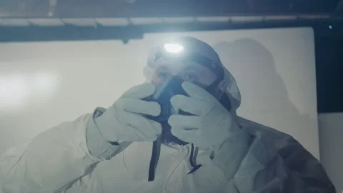Investigator evaluates sample in deserted icy building atmosphere. Researcher Stock Footage 346475282