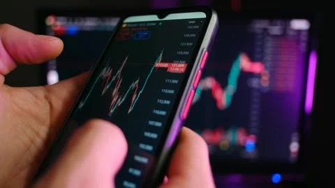 Investor analyzing cryptocurrency candlestick chart on smartphone Stock-Footage 321736694