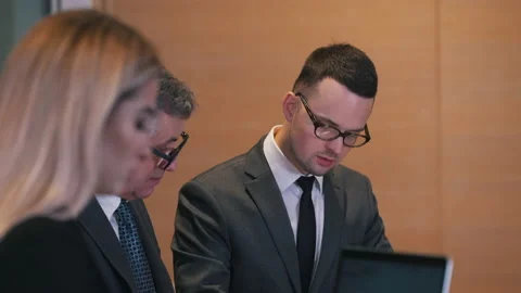 The investor explains the data to his partner Stock Footage 150231398