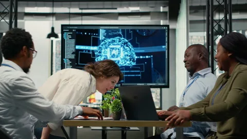 Investors meeting with software developers in startup office Stock Footage 323408780