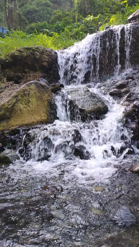 Invigorating Waterfall Cascading Over Rocks Stock Footage 311449053