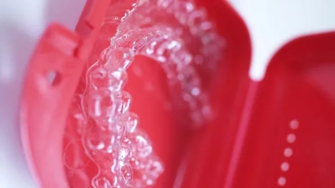 Invisalign clear aligner in red containe... | Stock Video | Pond5