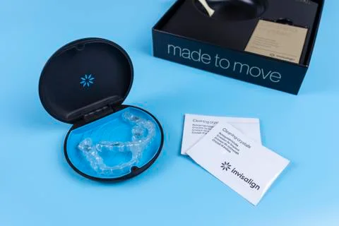 Invisalign transparent brackets container and package. Cleaning crystals and box Stock Photos