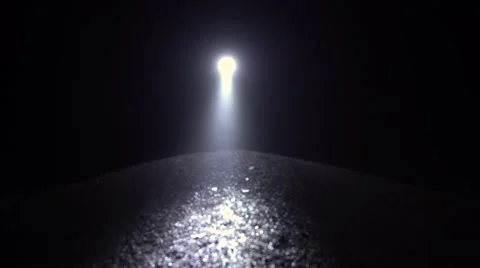 Invisible man with a flashlight in his hand walks on a totally dark area. Stock-Footage 68591999