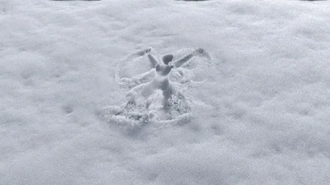 Invisible man making snow angel design on a fresh snow Stock Footage 101439080