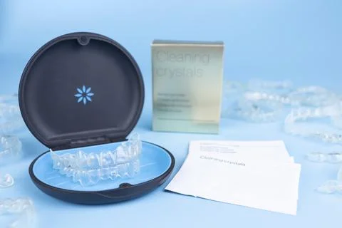 Invisible retainers case with orthodontic aligner brackets. Black plastic dental Stock Photos