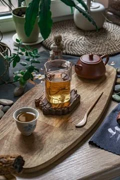 An Inviting and Serene Tea Setup Featuring Natural Elements Alongside Cozy Decor 写真素材