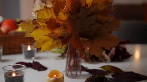 Inviting Autumn Decor Featuring Beautiful Candles and Natural Elements Video stock 286121642