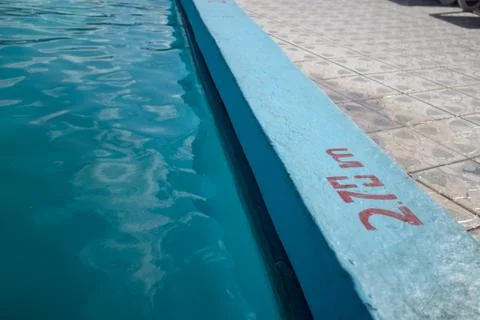 Inviting blue pool with 2.70m depth marking Stock Photos