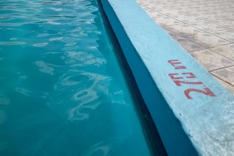 Inviting blue pool with 2.70m depth marking Stock Photos
