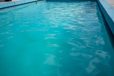 Inviting blue pool with ripples on the surface Stock Photos