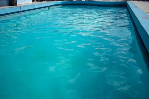 Inviting blue pool with ripples on the surface Stock Photos