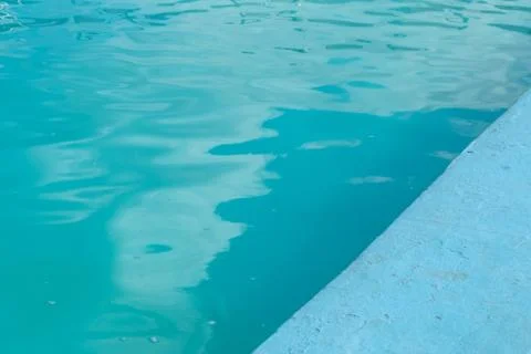 Inviting blue pool with ripples on the surface Stock Photos